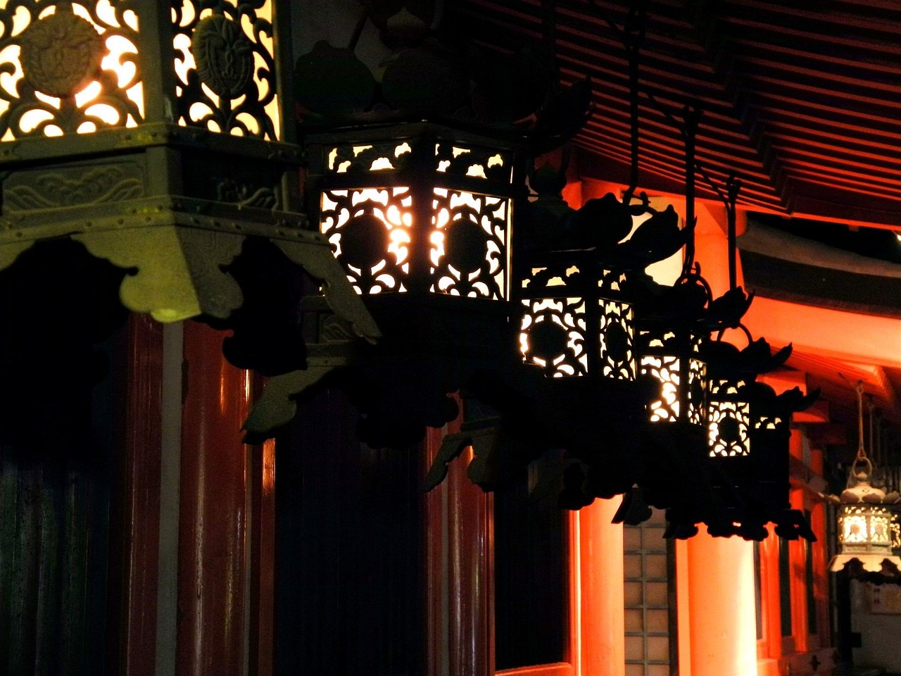 Kasuga Taisha Shrine Lanterns and Forest Paths with stone lanterns in dappled light