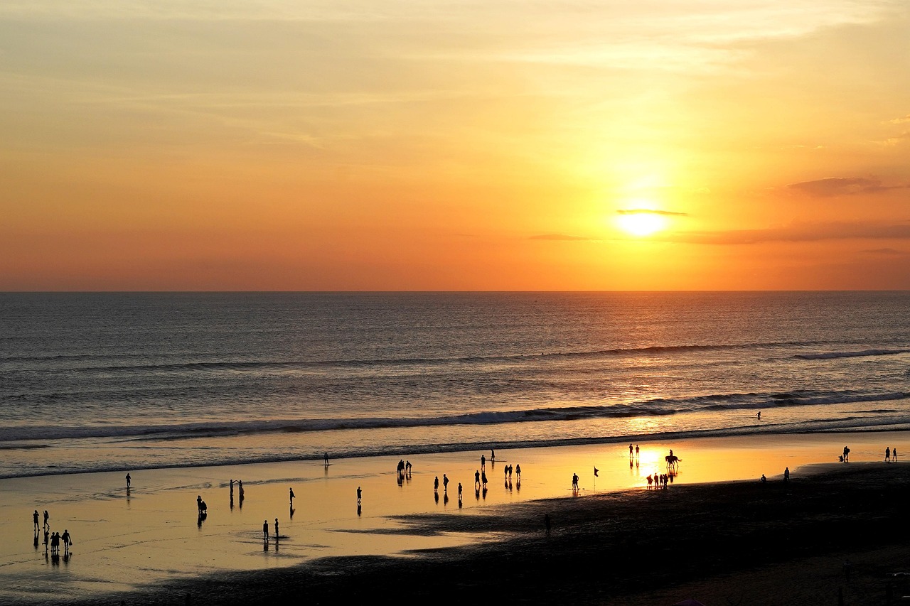 Bali beach style Seminyak beach clubs and sunset nights with a glowing horizon