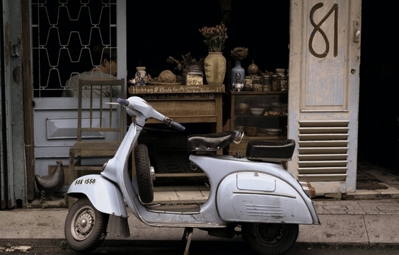 Fly to Ho Chi Minh City & Saigon After Dark Vespa Tour
